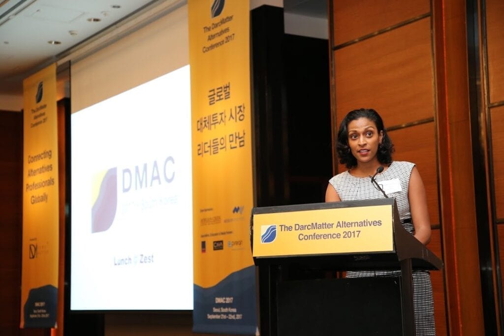 a person standing at a lectern giving a speech